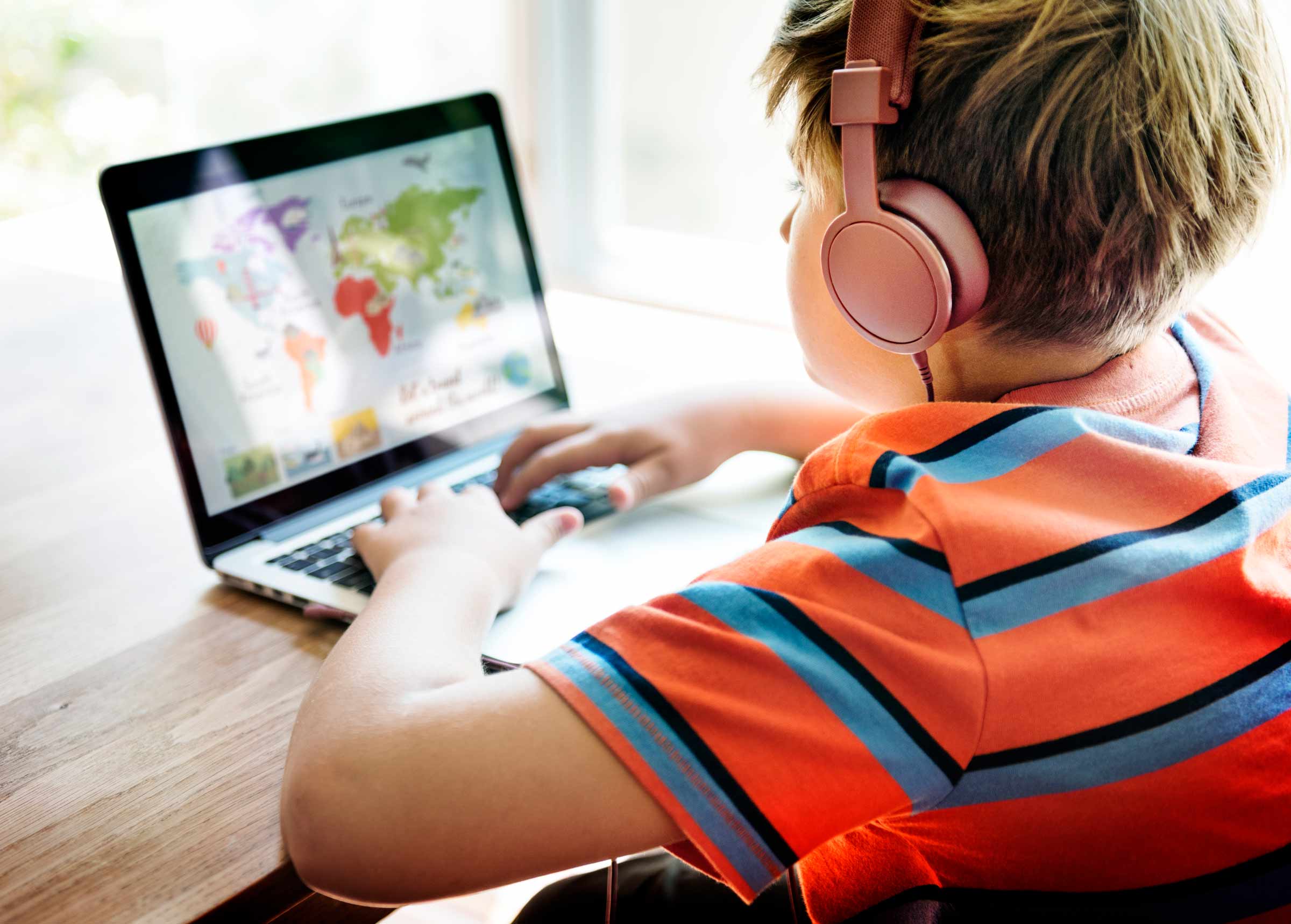 Child online with lesson Child using online tutoring platform